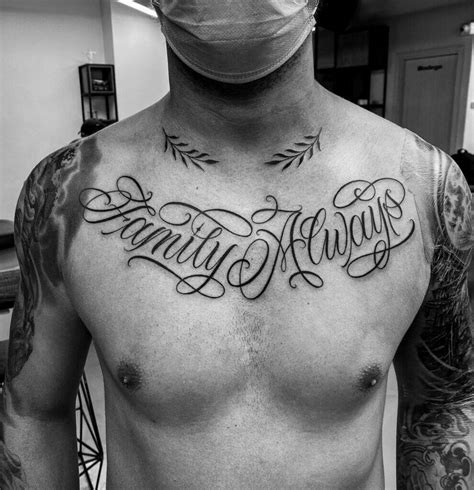 chest lettering tattoo